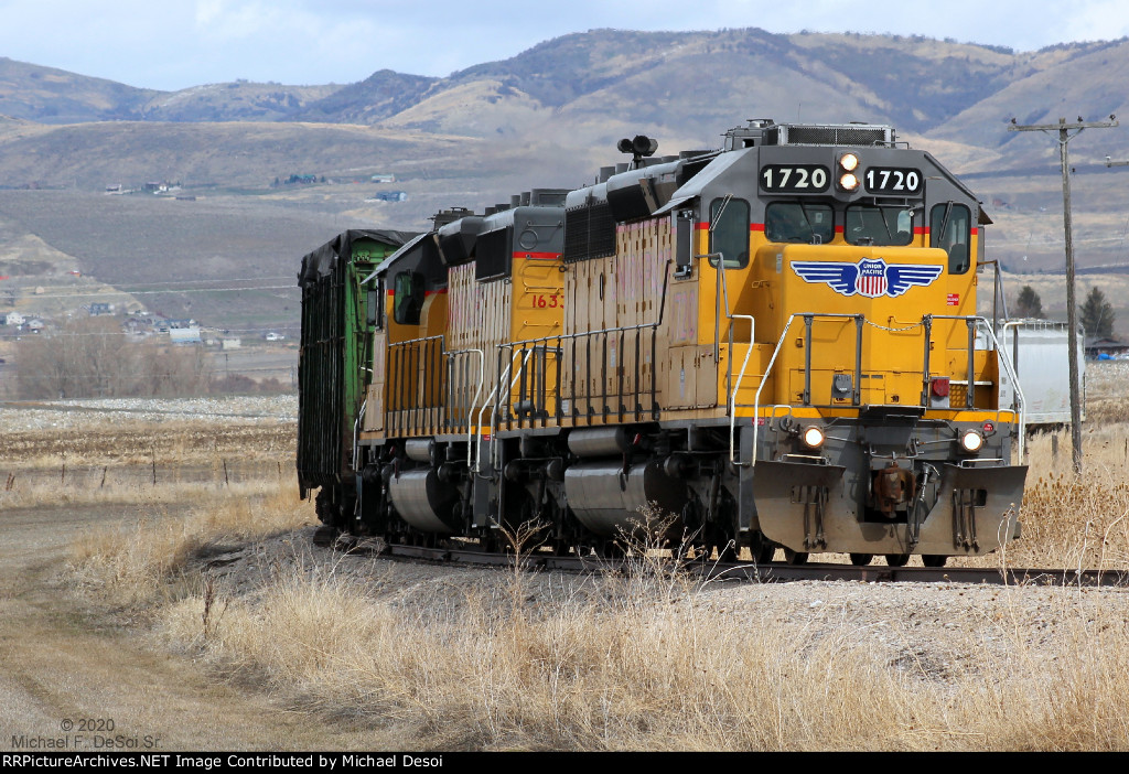 UP SD40Ns #1720 + 1633 lead the southbound Cache Valley Local approaching the 5400 S. Road Xing in Franklin, ID.  March 24, 2021